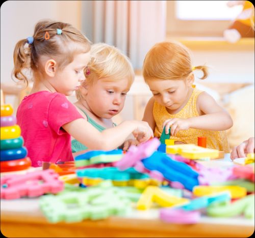Kindergarten Child playing with toy